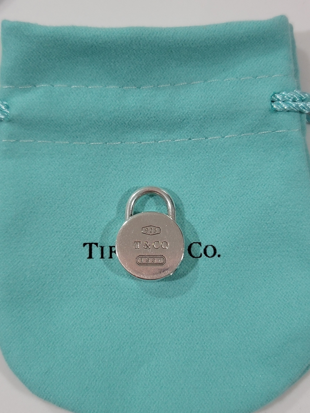 Tiffany & Co. Sterling Padlock Charm.
